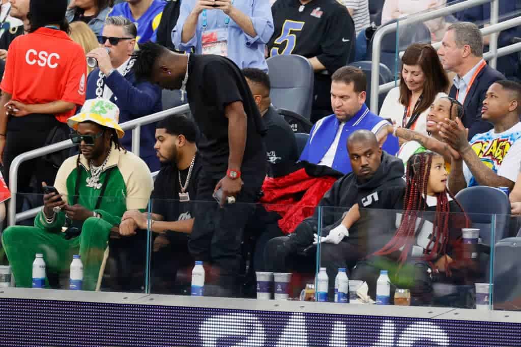 INGLEWOOD, CALIFORNIA - FEBRUARY 13: 2 Chainz, Tyga, YG, Antonio Brown, Kanye West and North West attend Super Bowl LVI between the Los Angeles Rams and the Cincinnati Bengals at SoFi Stadium on February 13, 2022 in Inglewood, California. (Photo by Steph Chambers/Getty Images)