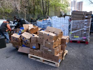 Food is gathered to prepare for distribution from French Montana, NYPD and volunteers to those in need in South Bronx on November 23, 2020 in New York City. 