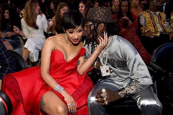 Cardi b. getting kiss from Offset