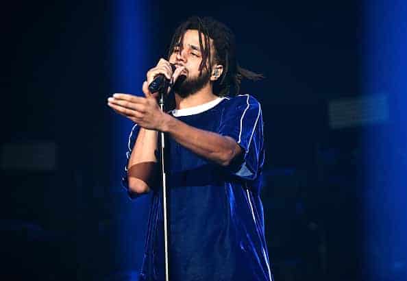 J Cole performs onstage at Staples Center