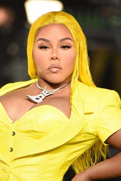 Lil Kim in yellow dress with yellow hair