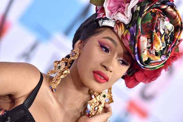 Cardi B attends the 2018 AMAs in flower print hat