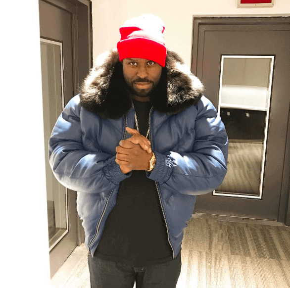 Man in down jacket and red hat