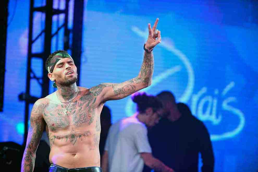 Chris Brown giving peace sign