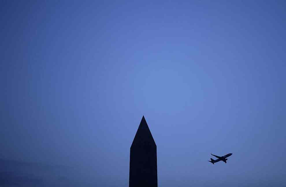 silhouette of Washington Monument and Airplane