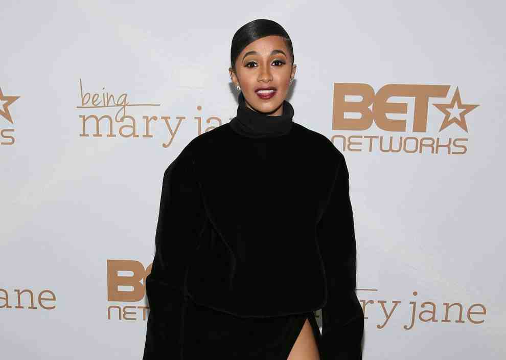 Cardi B in front of Being Mary Jane BET Network