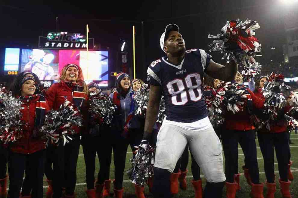 New England Patriot Martellus Bennet in jersey #88 on field at Gillette Stadium in front of NE Patriots cheerleaders
