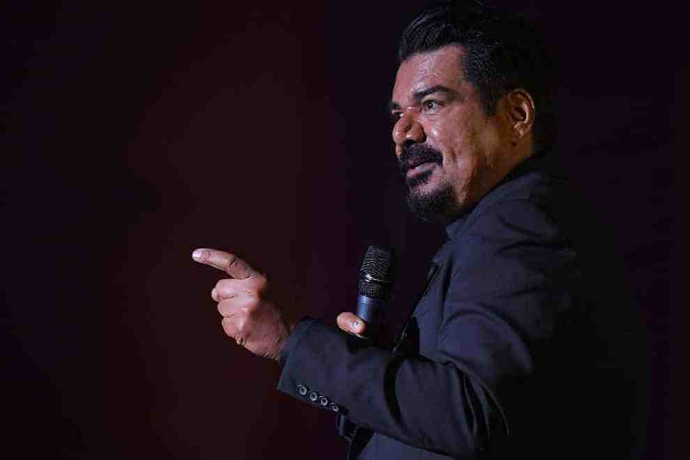 George Lopez with microphone on stage