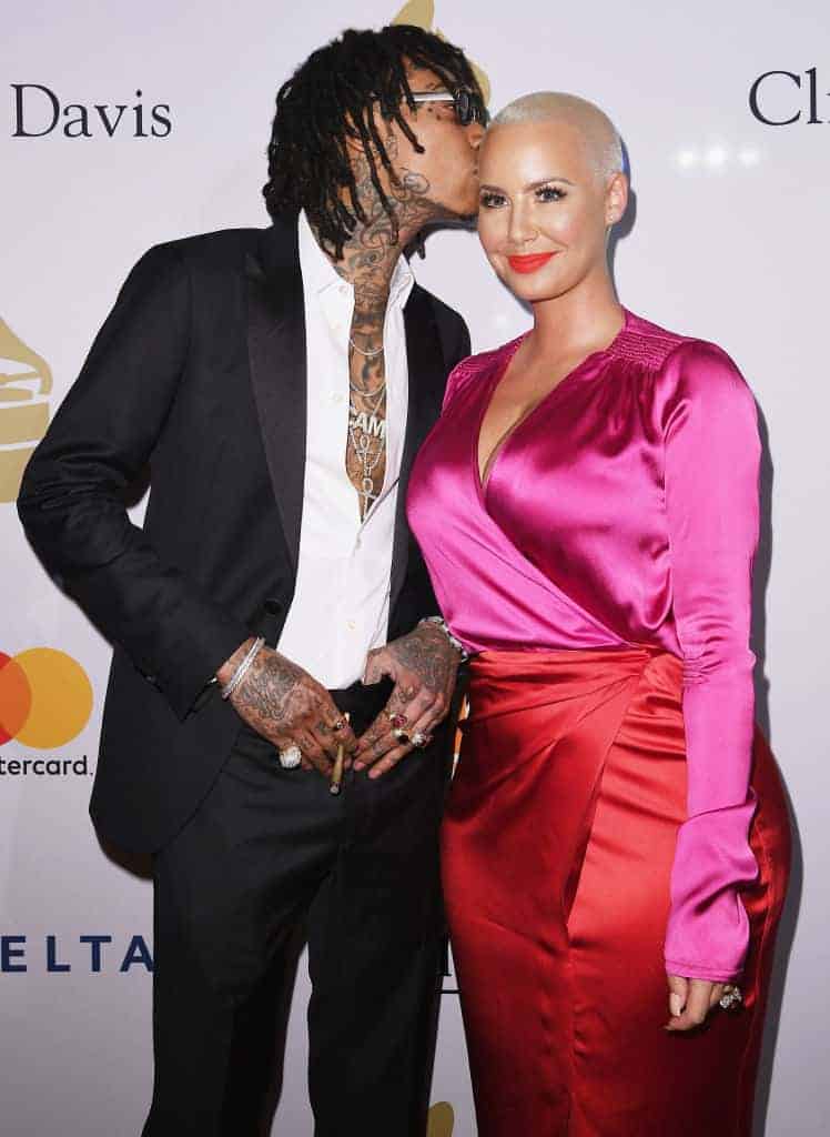 Wiz Khalifa kissing Amber Rose's head at Clive Davis Pre-Grammys party