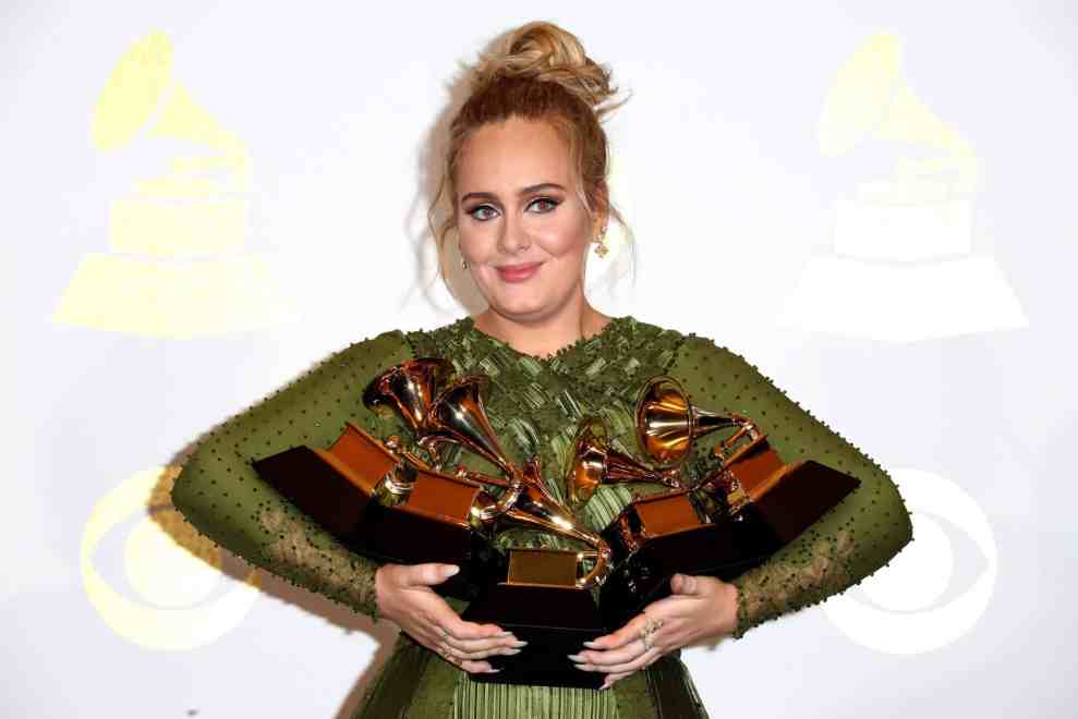 Adele with her three grammy awards