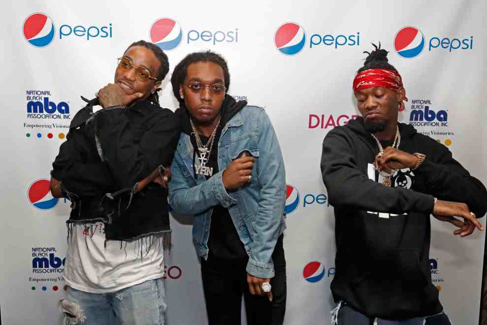 Migos posing on red carpet at National Black MBA Association Inc. Empowering Visionaries event co-sponsored with pepsi