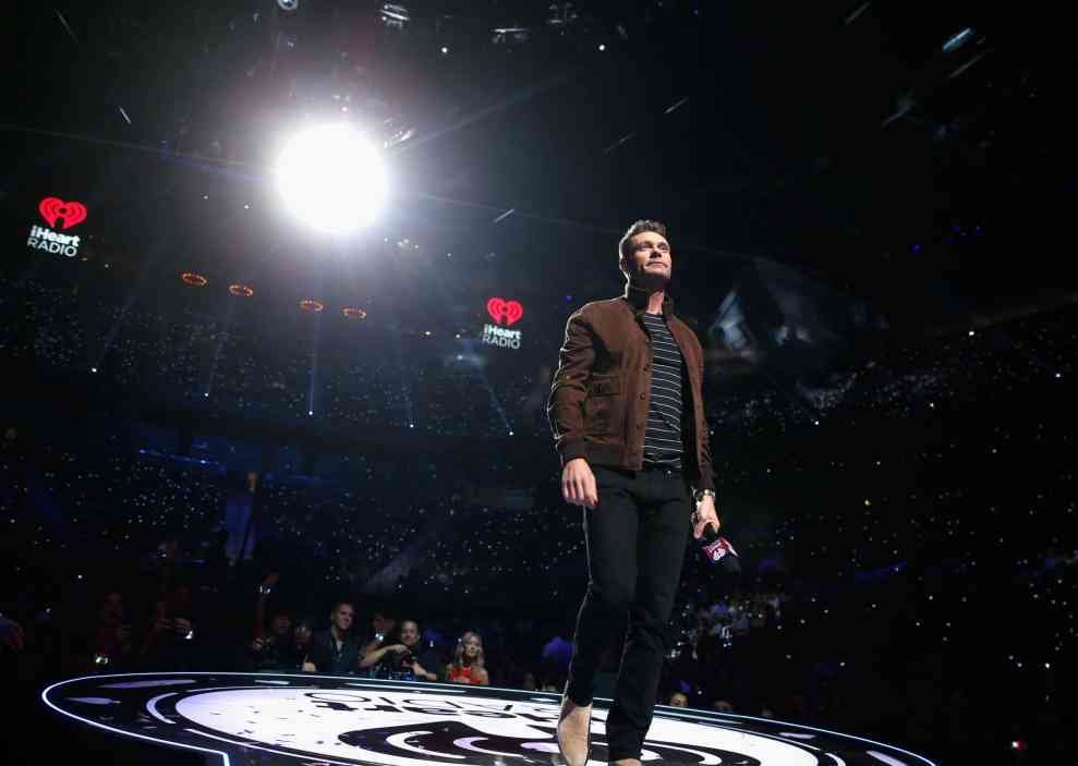 Ryan Seacrest on stage at iHeart Radio event
