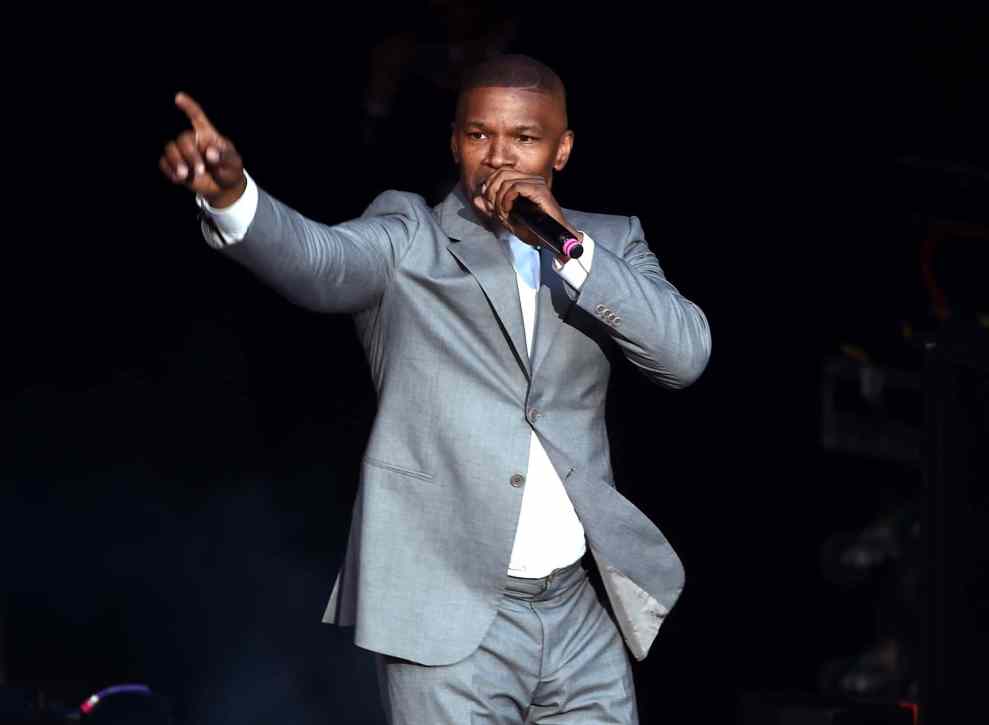Jamie Foxx with microphone on stage
