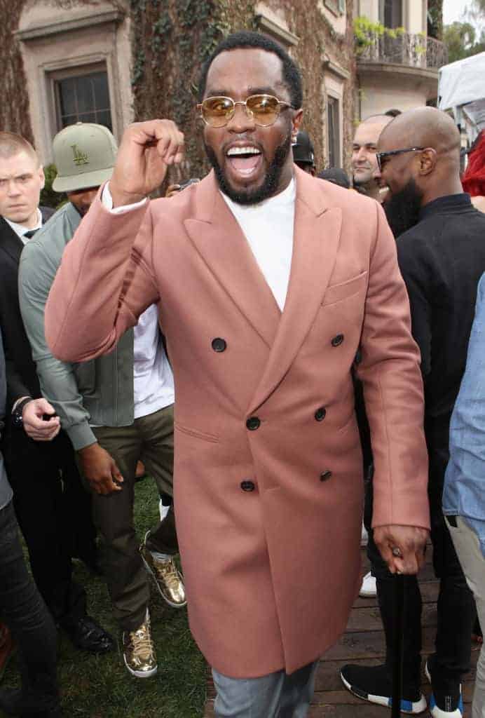 Diddy in long pink coat with