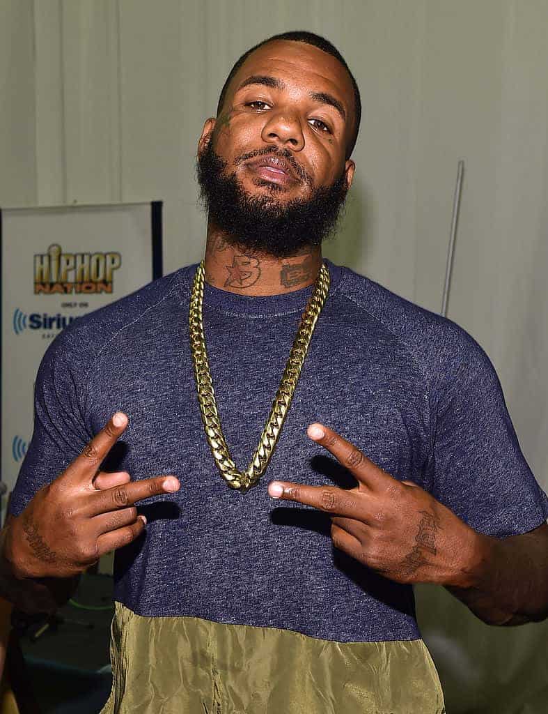 The Game giving two peace signs