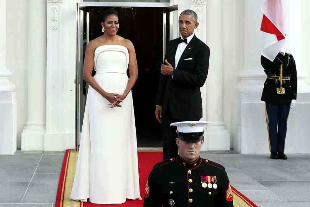 Michelle and Barak Obama in formal attire at the white house