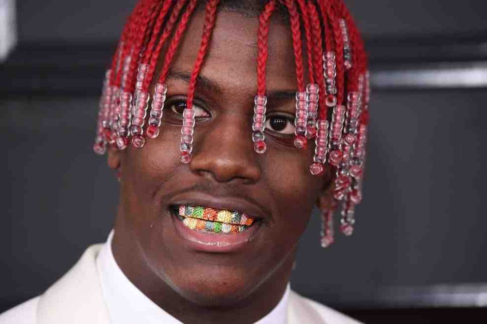 Lil Yachty with red dreads and rainbow grill at grammys