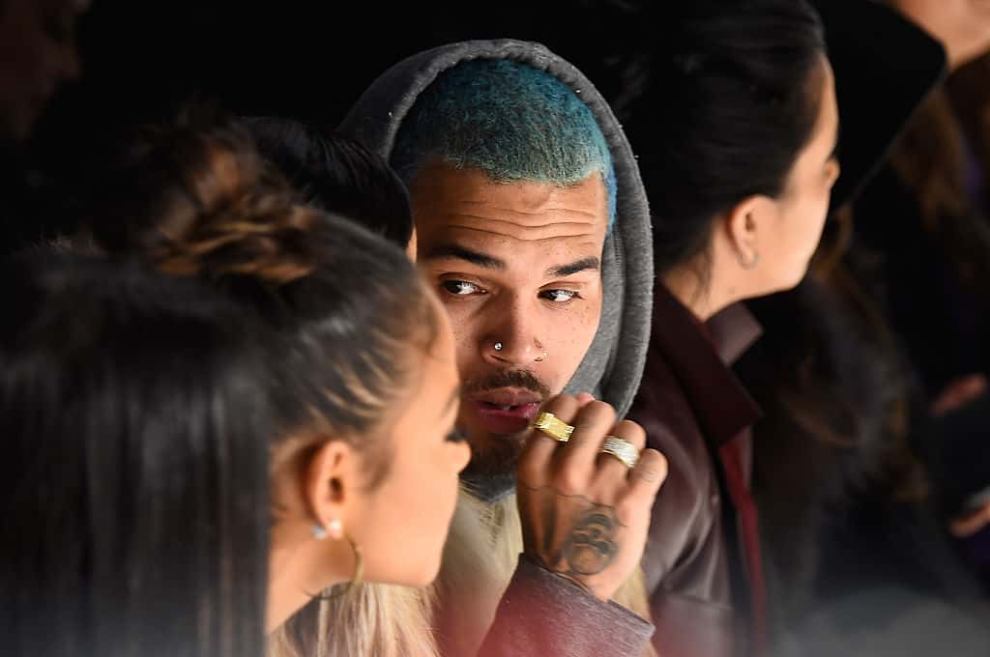 Karrueche and Chris Brown sitting together at event