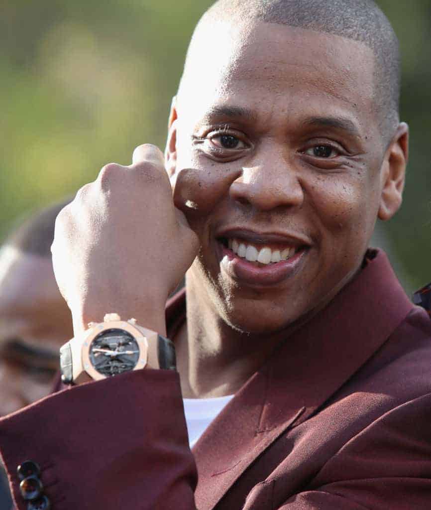 Jay Z displaying black and gold watch