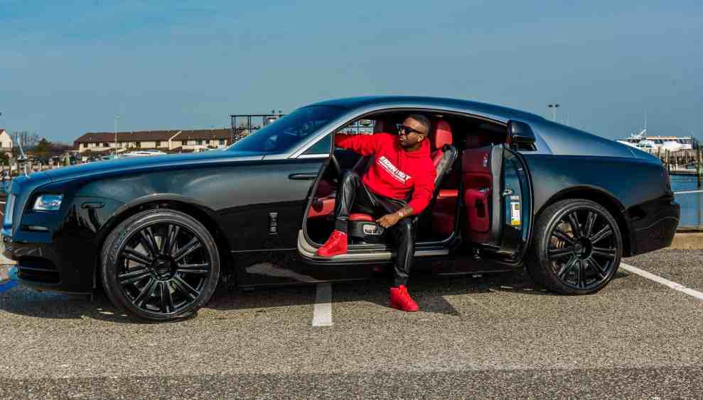 DJ Magic stepping out of black car