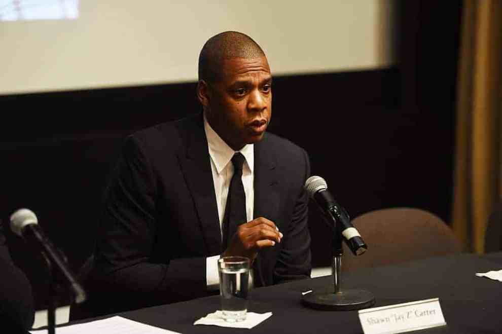 Jay Z in business suit on panel