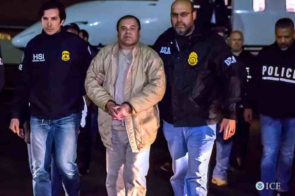 El Chapo in handcuffs escorted by HSI and DEA agents