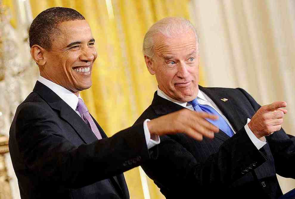 Obama and Biden laughing and pointing out together