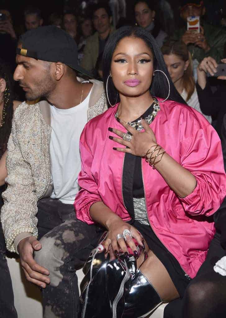 Nicki Minaj at event in black dress and hot pink shawl