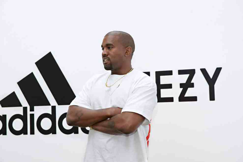 Kanye West in front of adidas Yeezy backtround