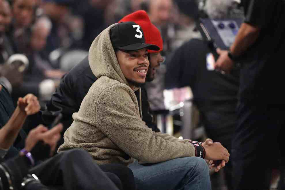Chance the Rapper sitting in crowd