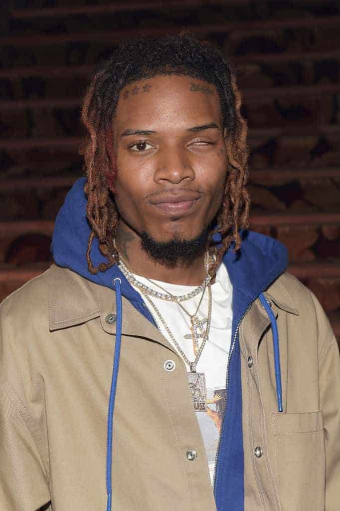 Fetty Wap in front of brick wall
