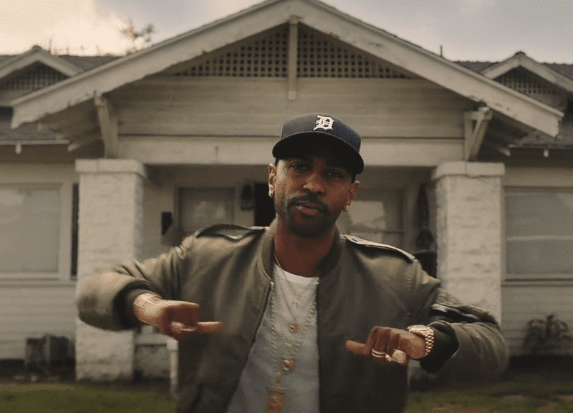 Big Sean in front of the house