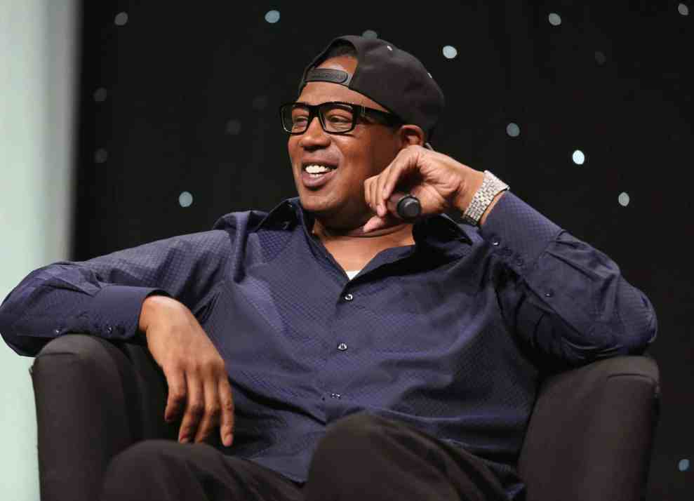 Master P giving interview in black chair