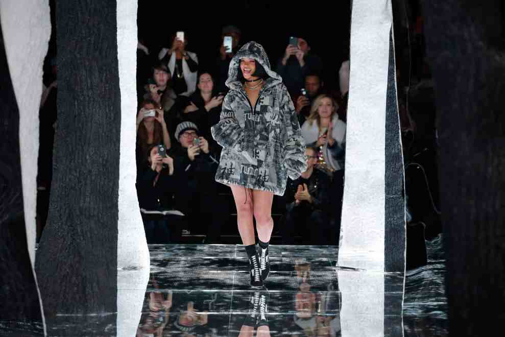 Rihanna on runway in fur hooded coat