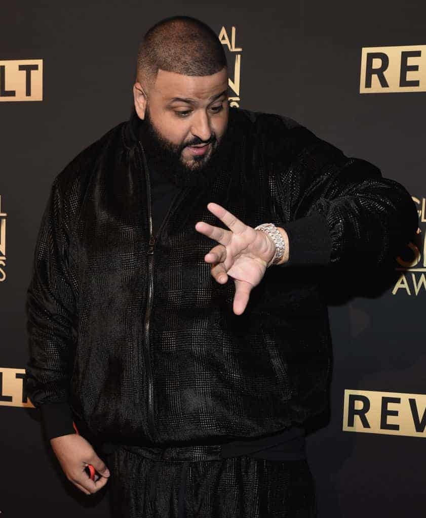 DJ Kahled looking at watch at awards event