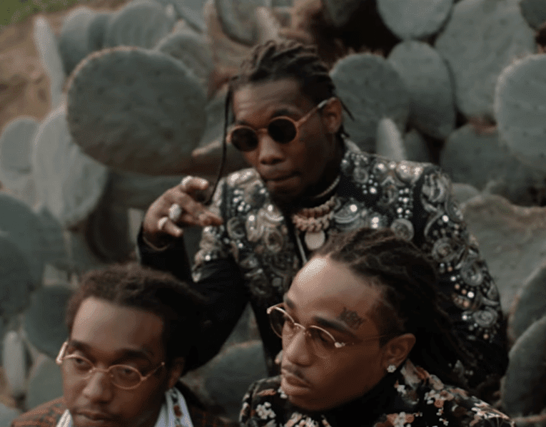 Migos posing in front of cacti
