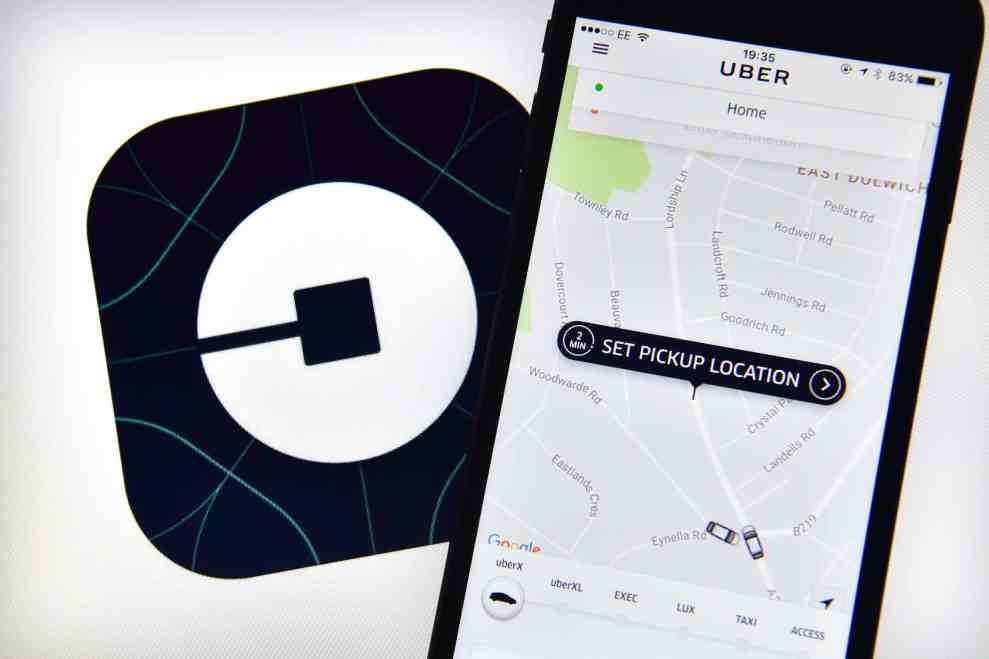 Uber logo and app showing on phone