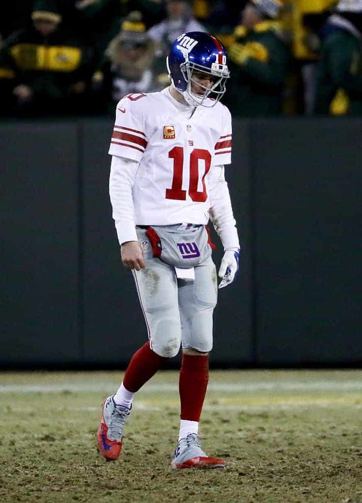 Eli Manning in #10 Giants jersey on field