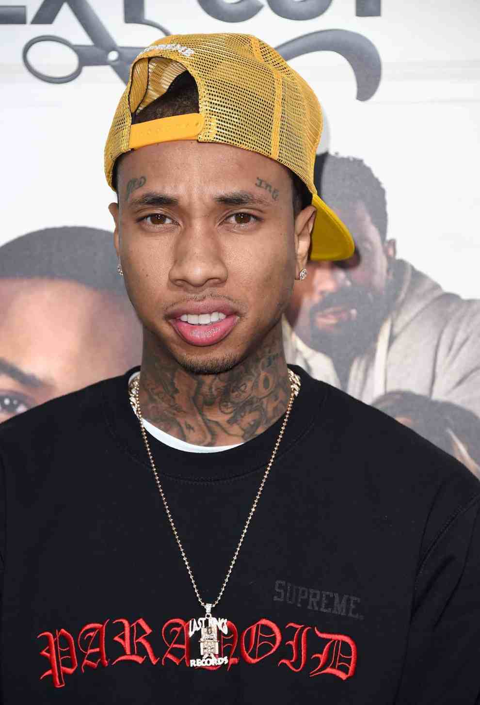 Tyga at movie premiere wearing Supreme Paranoid t-shirt