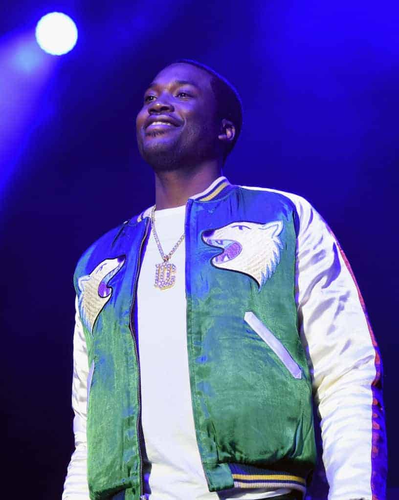 Meek Mill performing in green wolf jacket with DC chain