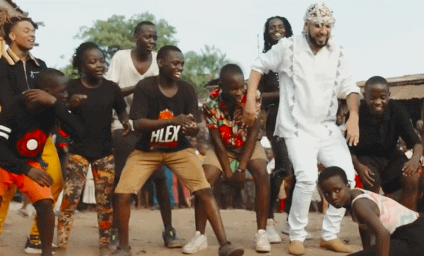 Screenshot from video of French Montana dancing with Ugandan youths