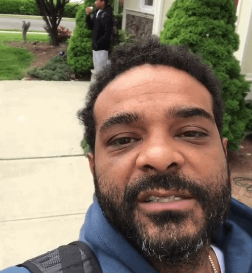 Still from video of Jim Jones disciplining 13 year old son by taking away his phone