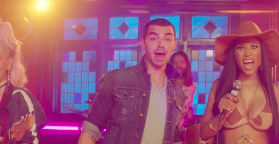 Still from video of DNCE featuring Nicki Minaj 'Kissing Strangers'