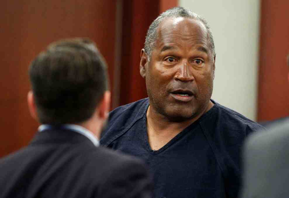 OJ Simpson in blue prison jumpsuit in court