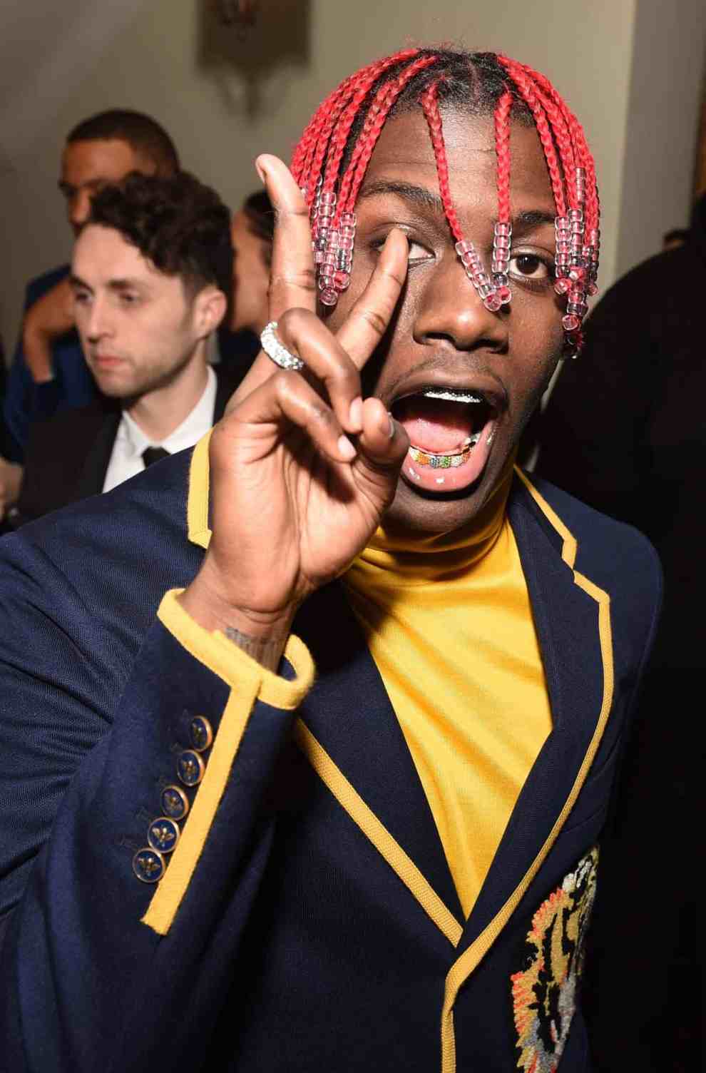 Lil Yachty with red dreads and rainbow grill at grammys