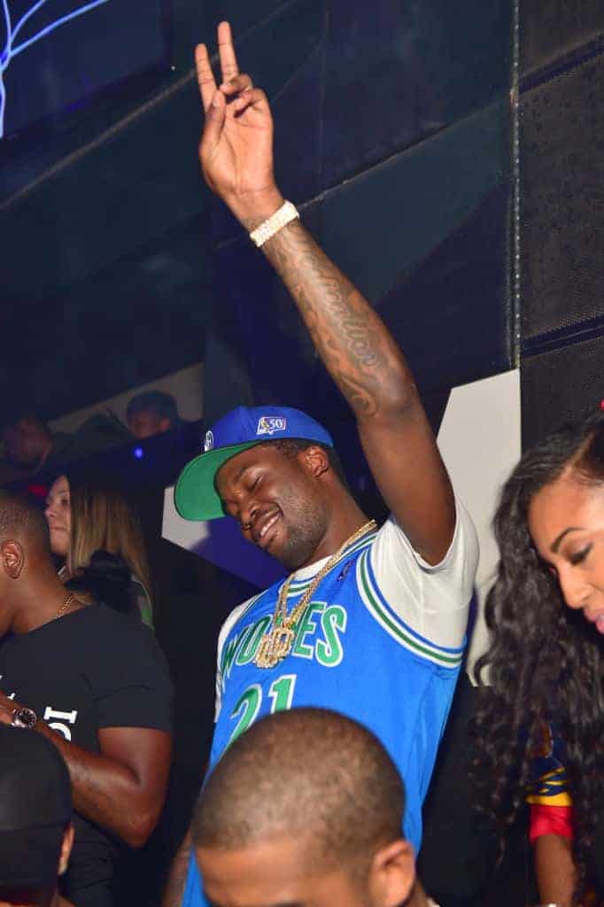 Meek Mill giving peace sign at Grammy after party hosted By Chris Brown at Gold Room