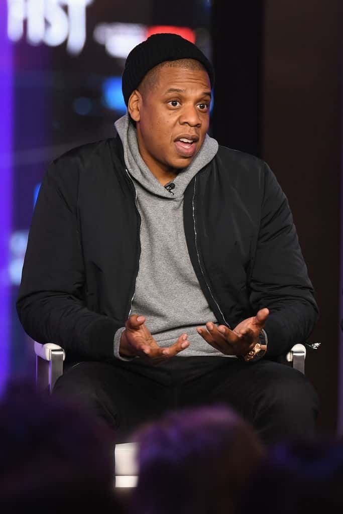Jay Z speaking to audience in casual clothes