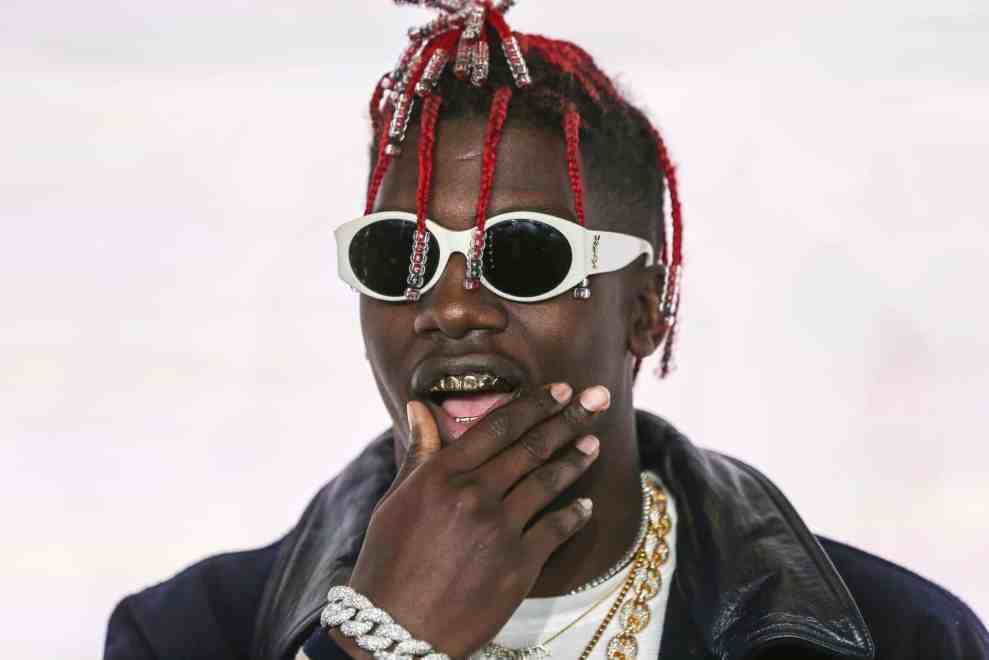 Lil Yachty with red dreads and gold grill
