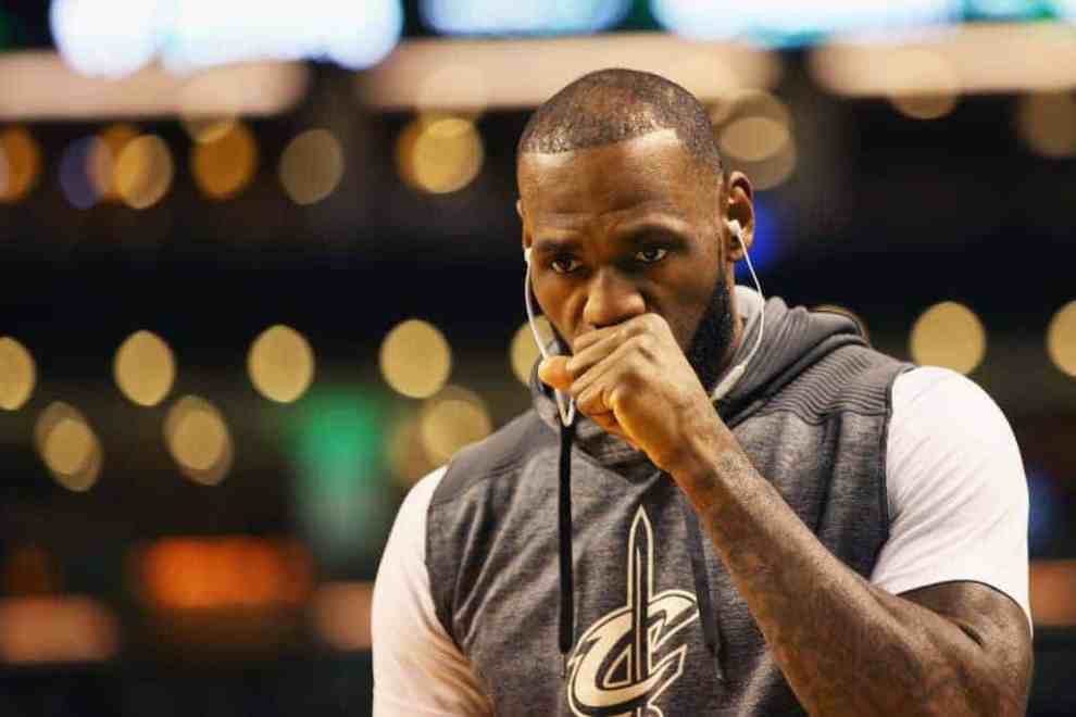 LeBron James in headphones and Cleveland Cavaliers sweatshirt
