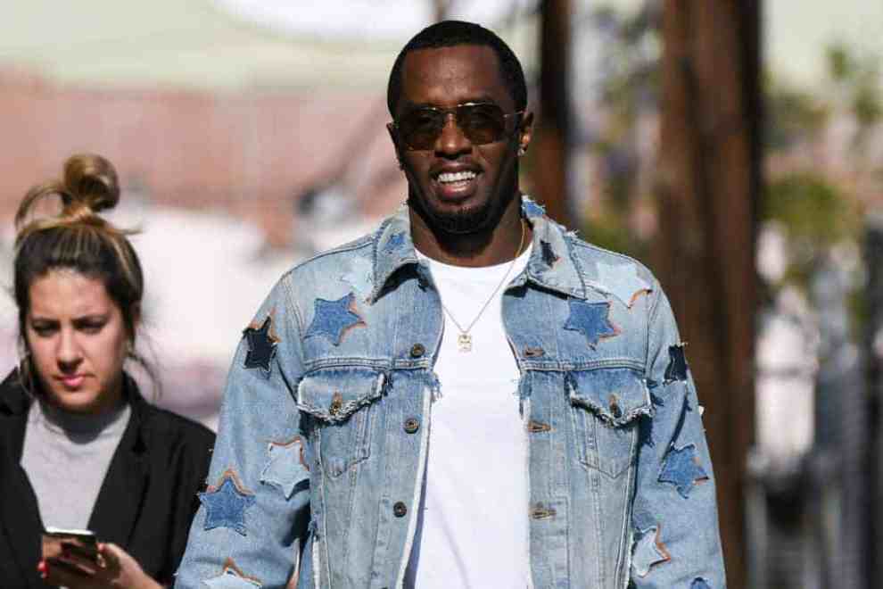 Diddy in Star Jean Jacket and white t-shirt walking down street